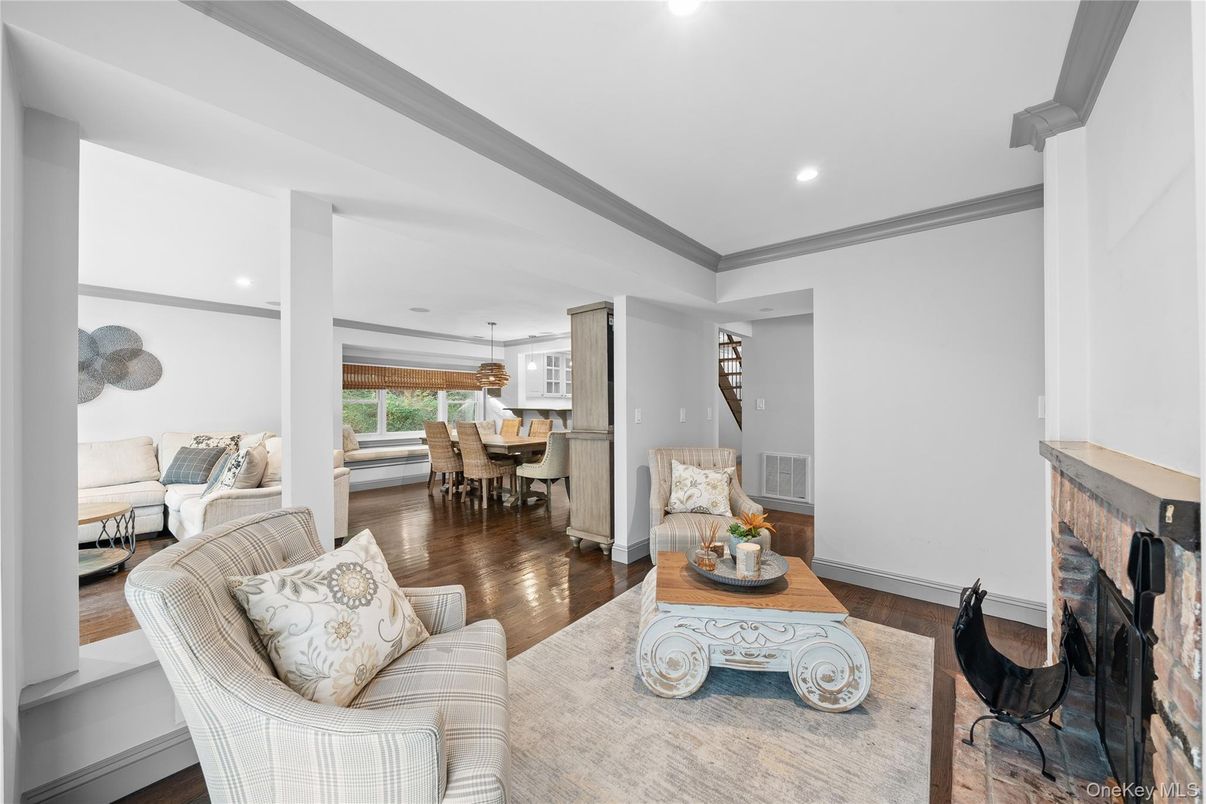 Dining room, Fireplace, Interior, Living room, Recessed Lighting, Wood Texture Flooring