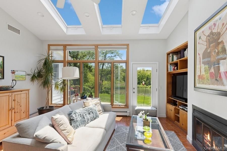 Fireplace, Glass Ceilings, Interior, Living room, Sun Room, Wood Texture Flooring
