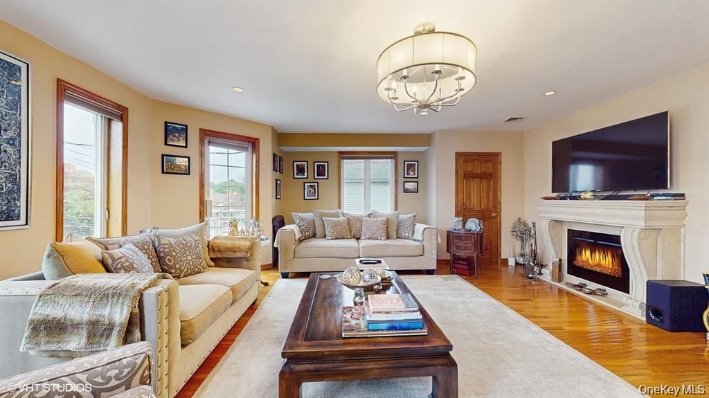 Chandelier, Fireplace, Interior, Living room, Recessed Lighting, Wood Texture Flooring