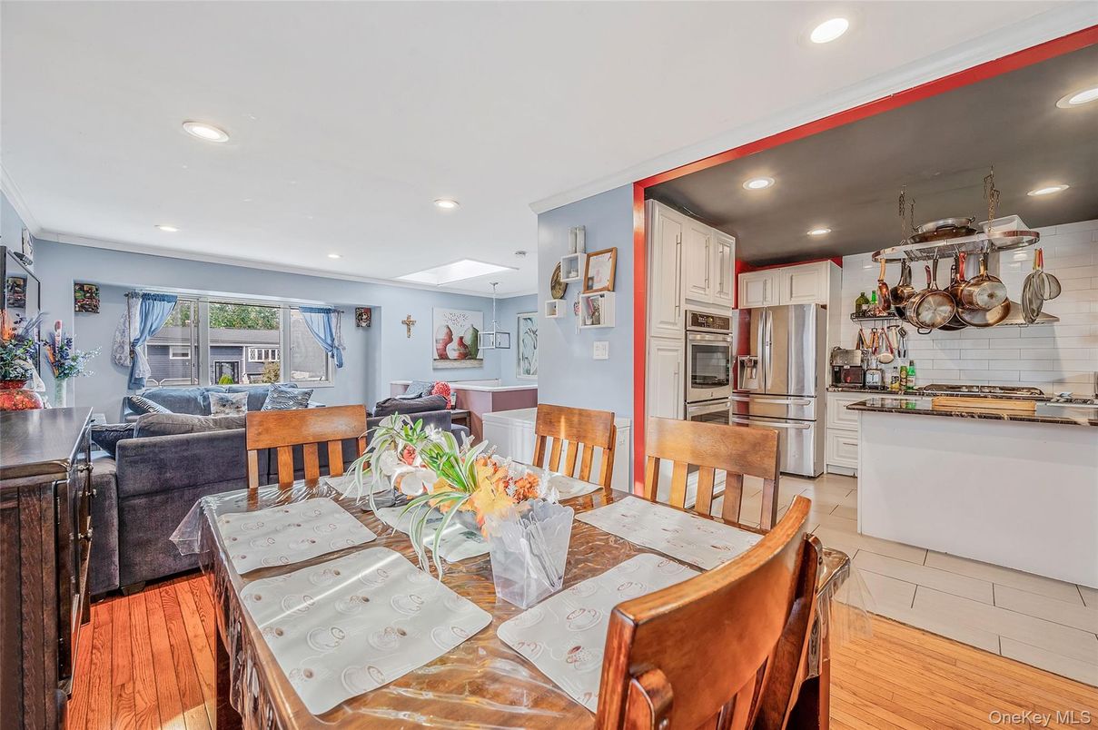Dining room, Interior, Kitchen, Living room, Recessed Lighting, Stainless Steel Appliances, Wood Texture Flooring