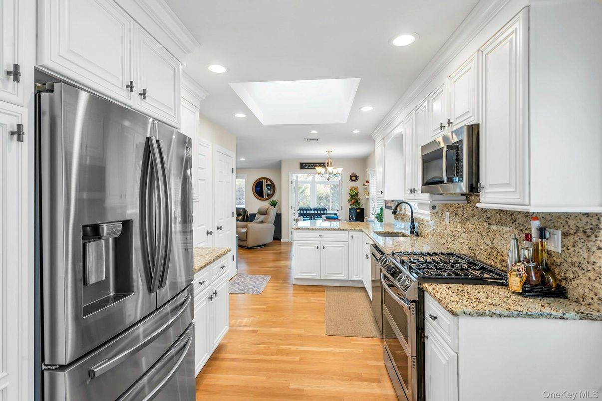 Chandelier, Interior, Kitchen, Recessed Lighting, Stainless Steel Appliances, Wood Texture Flooring