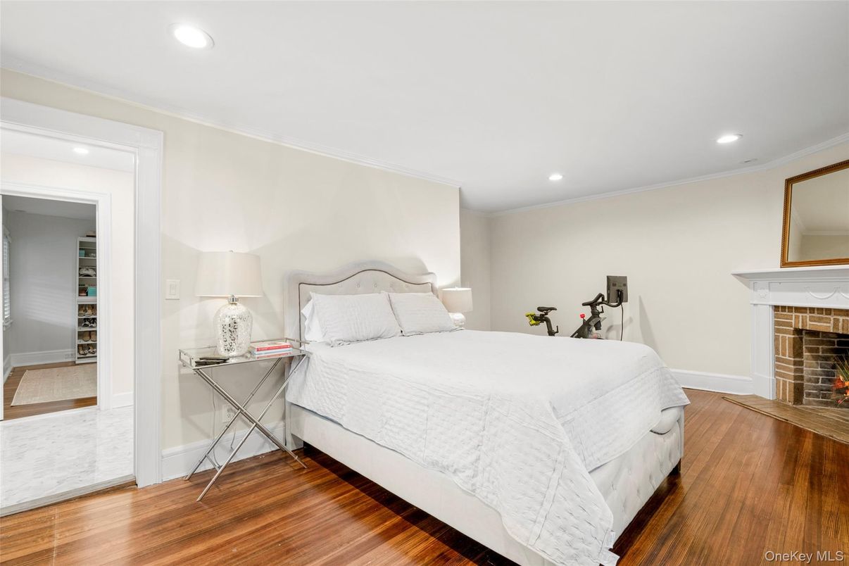 Bedroom, Fireplace, Fitness Equipment, Interior, Recessed Lighting, Wood Texture Flooring