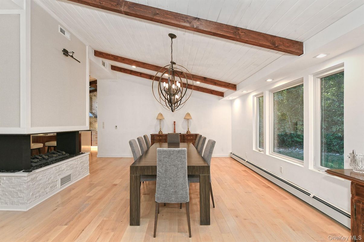 Chandelier, Dining room, Fireplace, Interior, Pendant Lights, Recessed Lighting, Wooden Beams, Wood Texture Flooring