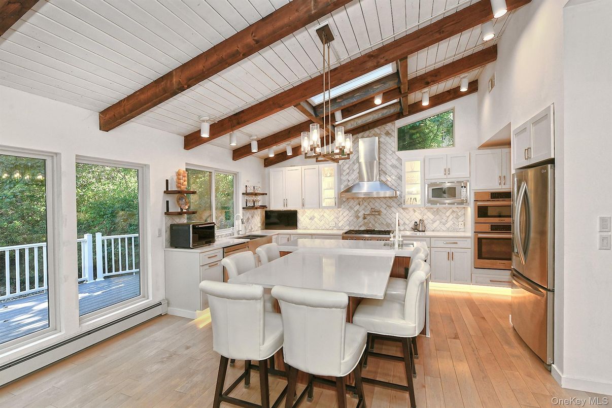 Chandelier, Dining room, Interior, Kitchen, Pendant Lights, Stainless Steel Appliances, Wooden Beams, Wood Texture Flooring