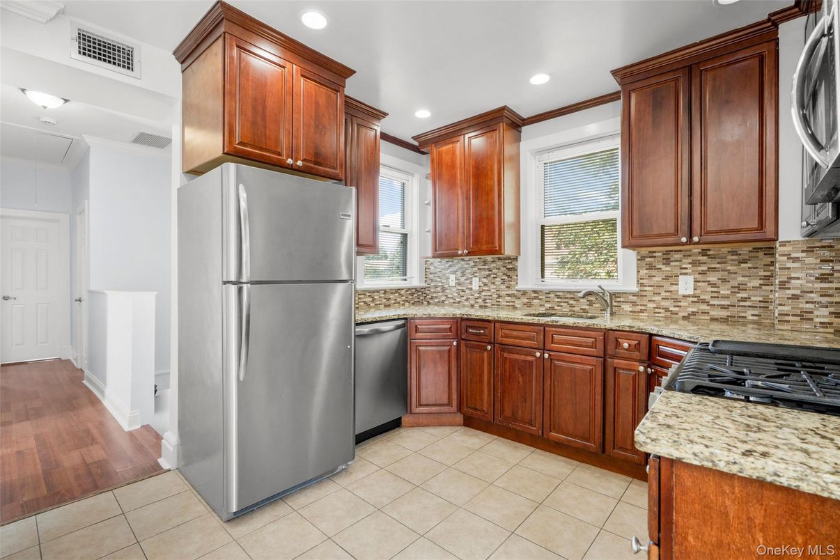 Interior, Kitchen, Recessed Lighting, Washer, Wood Texture Flooring