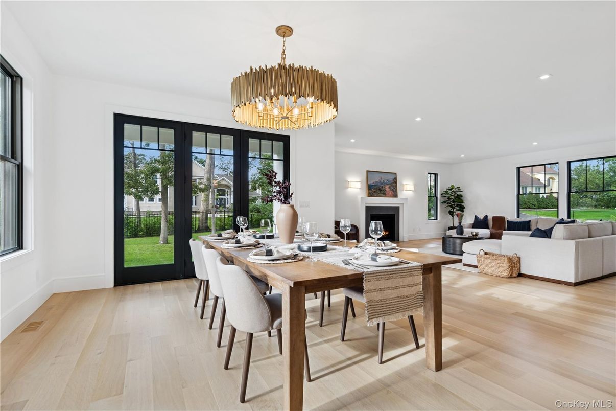 Chandelier, Dining room, Fireplace, Interior, Living room, Pendant Lights, Recessed Lighting, Wood Texture Flooring