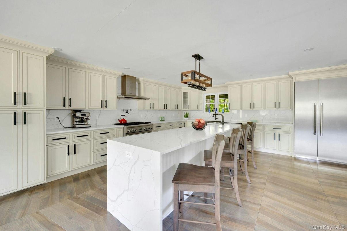 Interior, Kitchen, Marble Walls, Pendant Lights, Recessed Lighting, Stainless Steel Appliances, Wood Texture Flooring