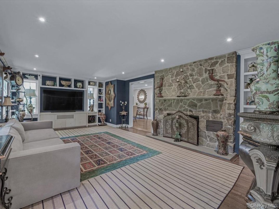 Fireplace, Interior, Living room, Recessed Lighting, Stone Walls, Wood Texture Flooring