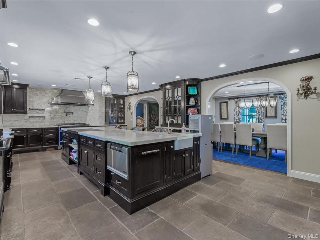 Chandelier, Dining room, Interior, Kitchen, Pendant Lights, Recessed Lighting, Stainless Steel Appliances, Stone Walls