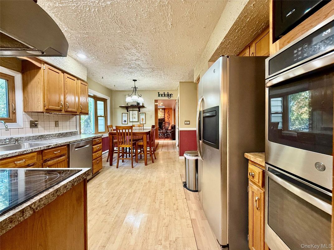 Dining room, Interior, Kitchen, Pendant Lights, Stainless Steel Appliances, Wood Texture Flooring