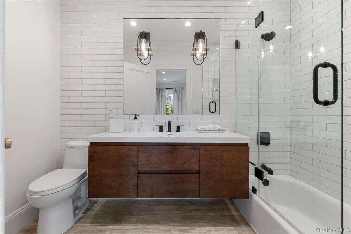 Bathroom, Dual Sink Vanities, Glass Shower, Interior, Recessed Lighting, Wood Texture Flooring