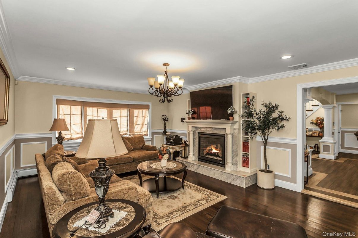 Chandelier, Fireplace, Interior, Living room, Recessed Lighting, Wood Texture Flooring