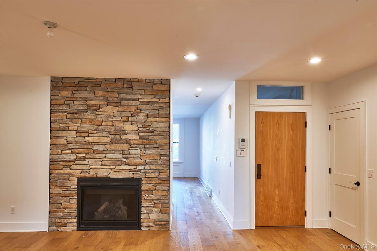 Fireplace, Interior, Recessed Lighting, Stone Walls, Wood Texture Flooring