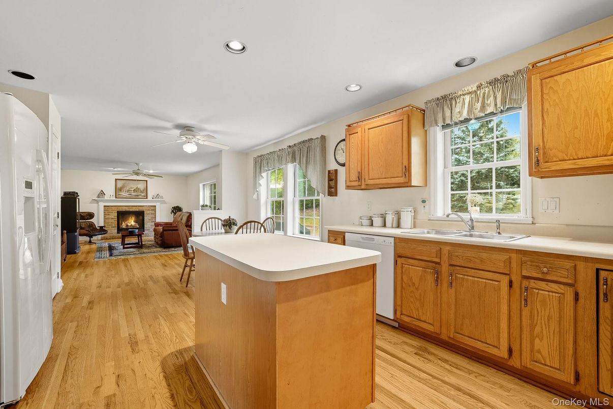 Dining room, Fireplace, Interior, Kitchen, Recessed Lighting, Wood Texture Flooring