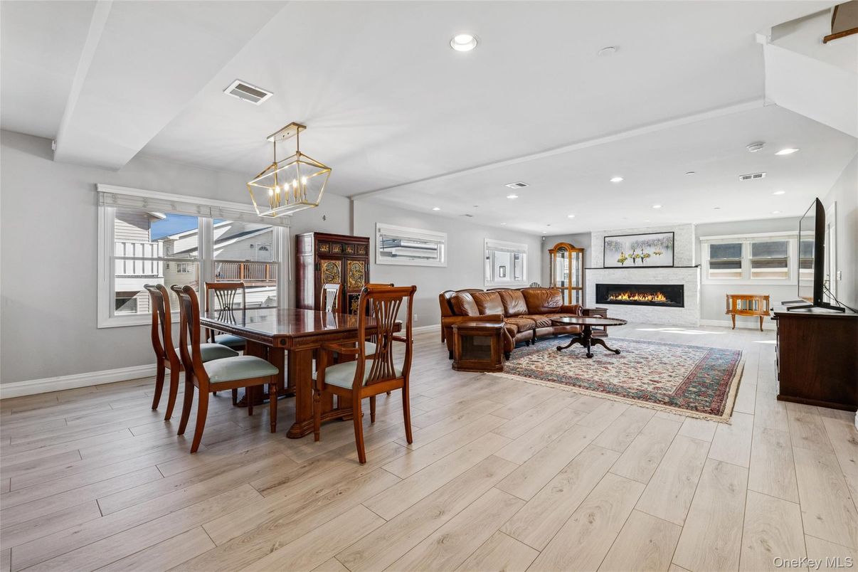 Dining room, Fireplace, Interior, Living room, Pendant Lights, Recessed Lighting, Wood Texture Flooring
