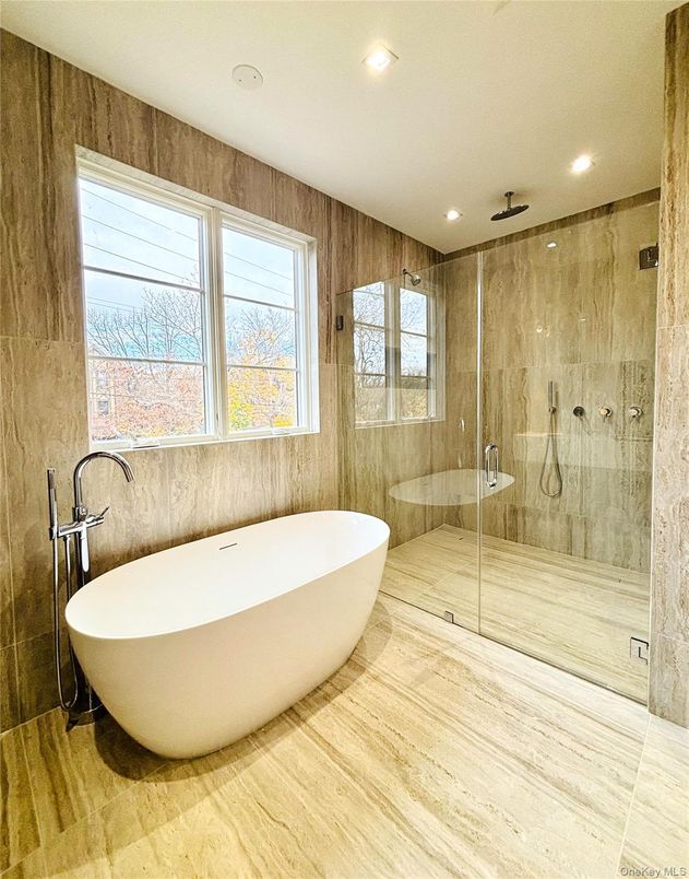 Bathroom, Free Standing Baths, Glass Shower, Interior, Recessed Lighting, Wood Texture Flooring, Wooden Walls