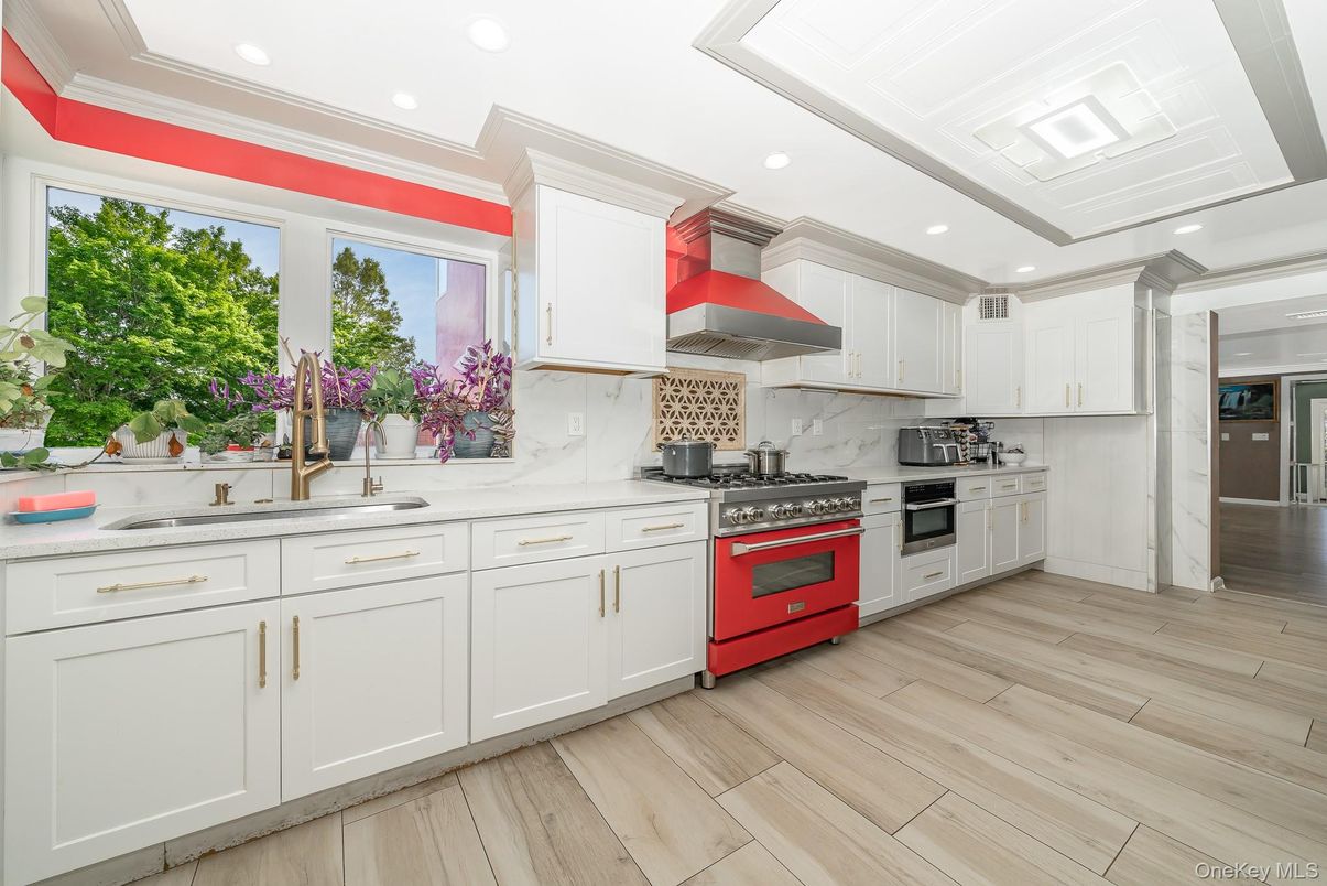 Interior, Kitchen, Marble Walls, Recessed Lighting, Stainless Steel Appliances, Wood Texture Flooring