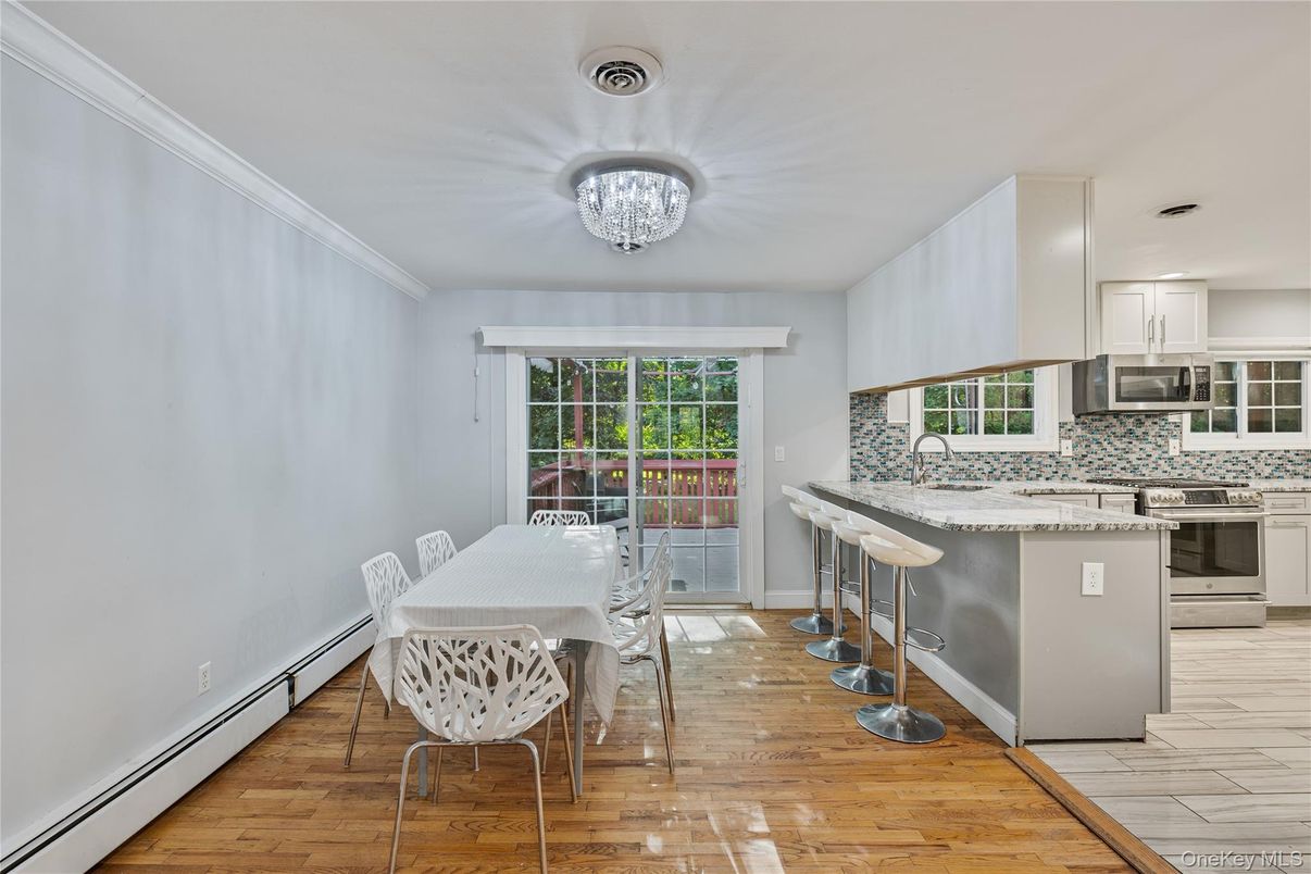 Chandelier, Dining room, Interior, Kitchen, Stainless Steel Appliances, Wood Texture Flooring