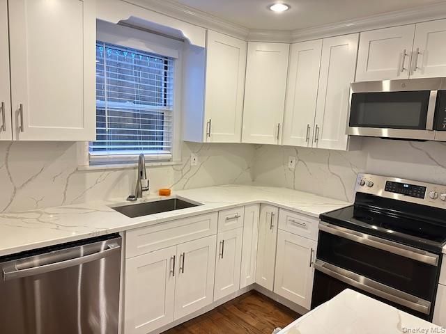 Interior, Kitchen, Marble Walls, Recessed Lighting, Stainless Steel Appliances, Wood Texture Flooring