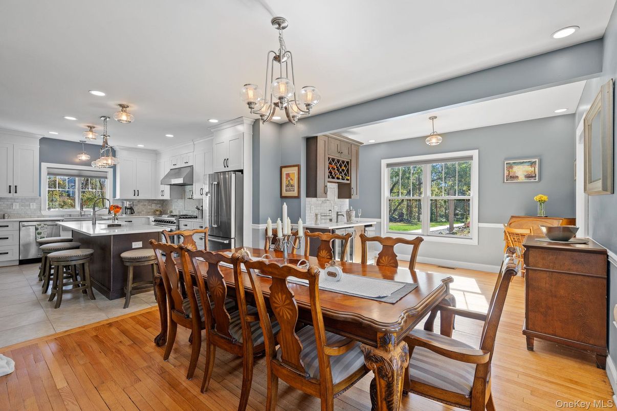 Chandelier, Dining room, Interior, Kitchen, Pendant Lights, Recessed Lighting, Stainless Steel Appliances, Wood Texture Flooring