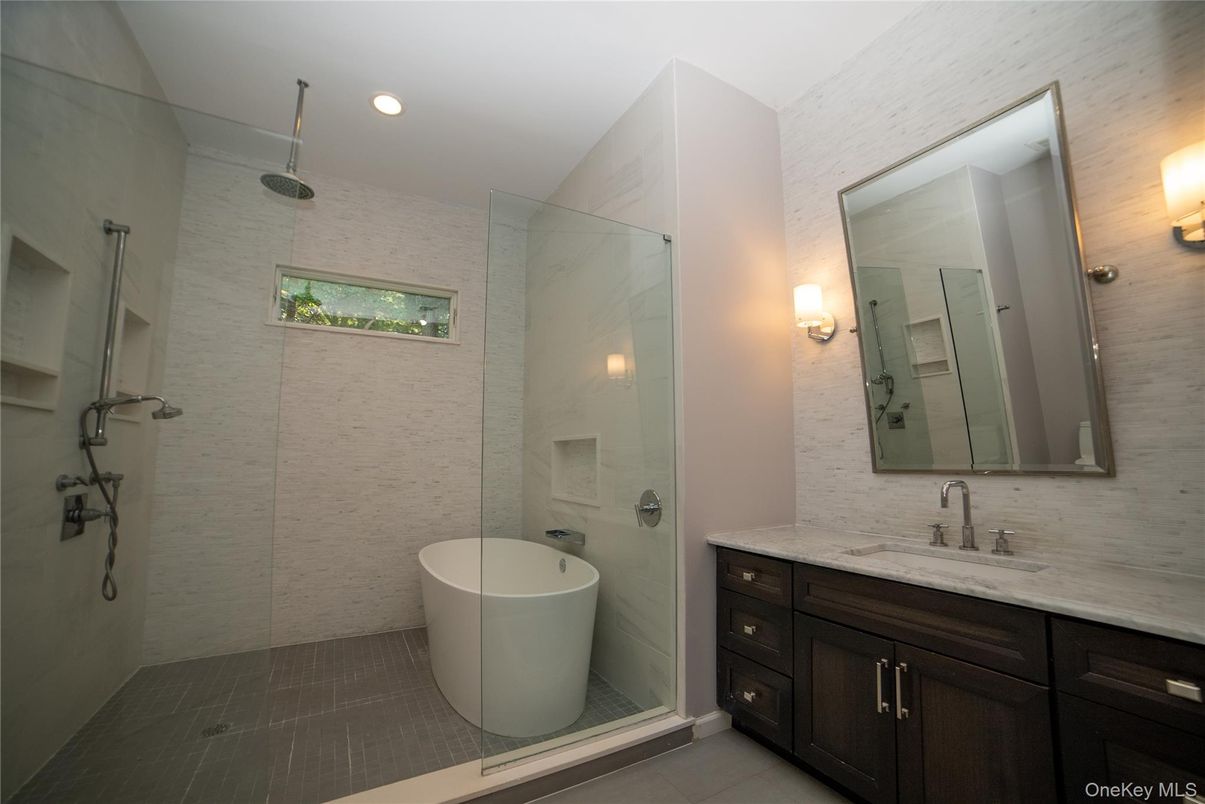 Bathroom, Dual Sink Vanities, Free Standing Baths, Glass Shower, Interior, Marble Walls, Recessed Lighting