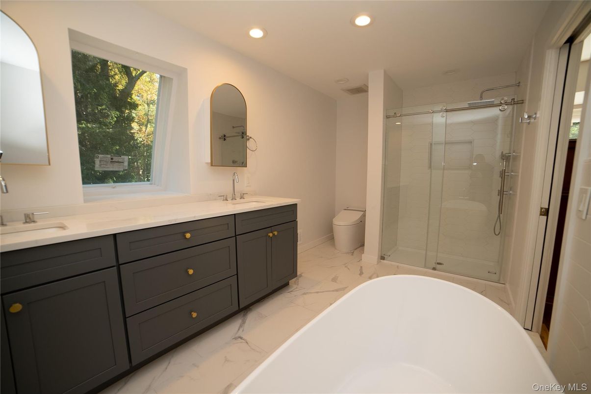 Bathroom, Dual Sink Vanities, Free Standing Baths, Glass Shower, Interior, Marble, Recessed Lighting