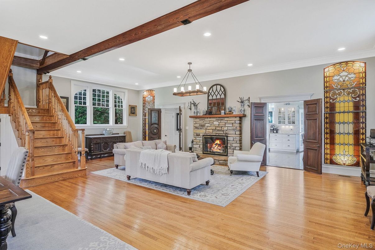 Chandelier, Fireplace, Interior, Living room, Pendant Lights, Recessed Lighting, Wooden Beams, Wood Texture Flooring