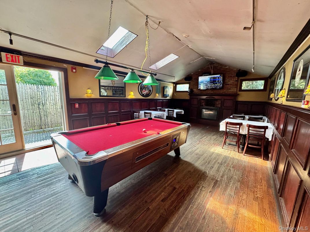 Billiard Table, Fireplace, Game Room, Interior, Pendant Lights, Wood Texture Flooring
