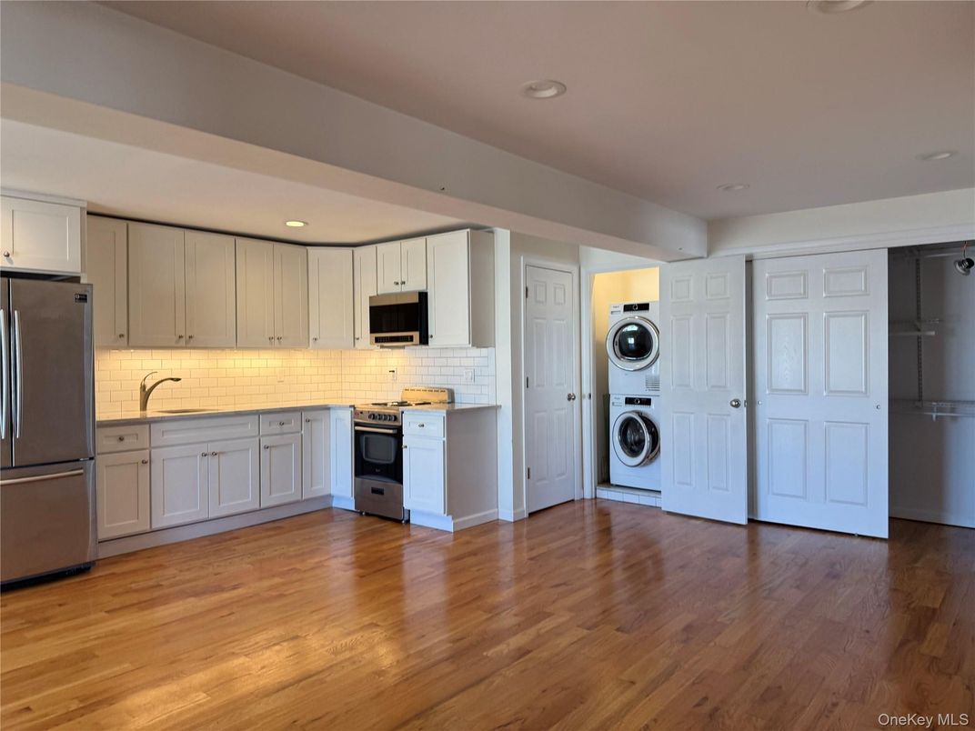 Interior, Kitchen, Recessed Lighting, Stainless Steel Appliances, Washer, Wood Texture Flooring