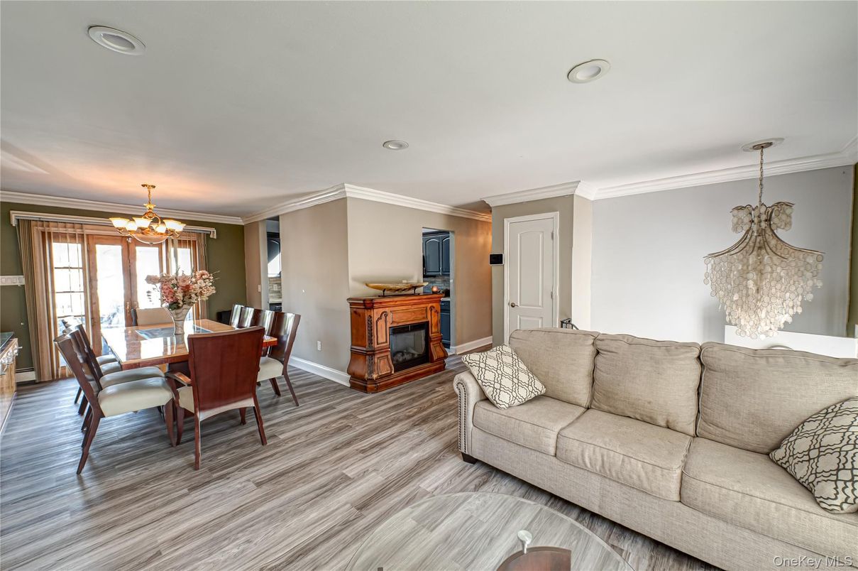 Chandelier, Dining room, Fireplace, Interior, Living room, Recessed Lighting, Wood Texture Flooring