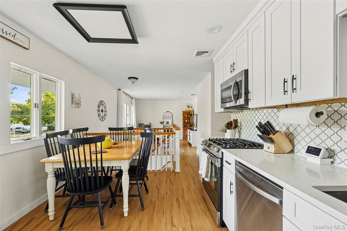Dining room, Interior, Kitchen, Recessed Lighting, Stainless Steel Appliances, Wood Texture Flooring