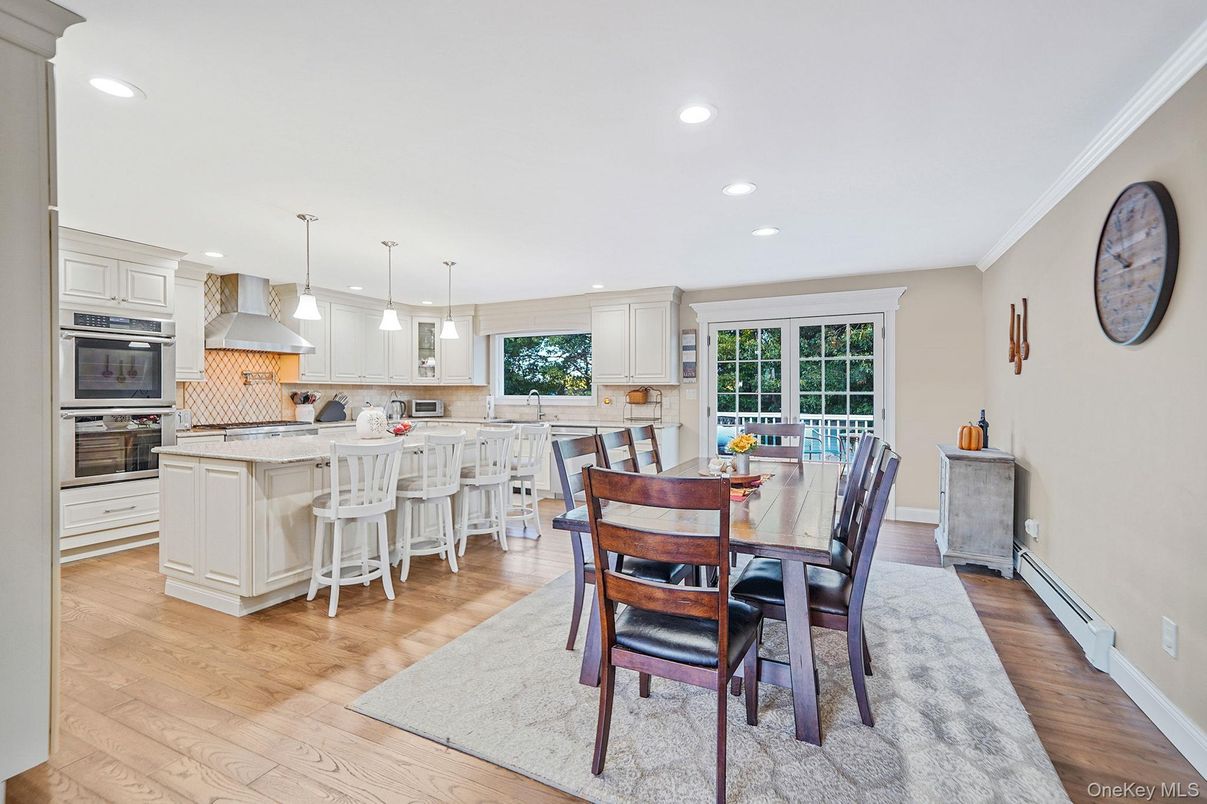 Dining room, Interior, Kitchen, Pendant Lights, Recessed Lighting, Stainless Steel Appliances, Wood Texture Flooring