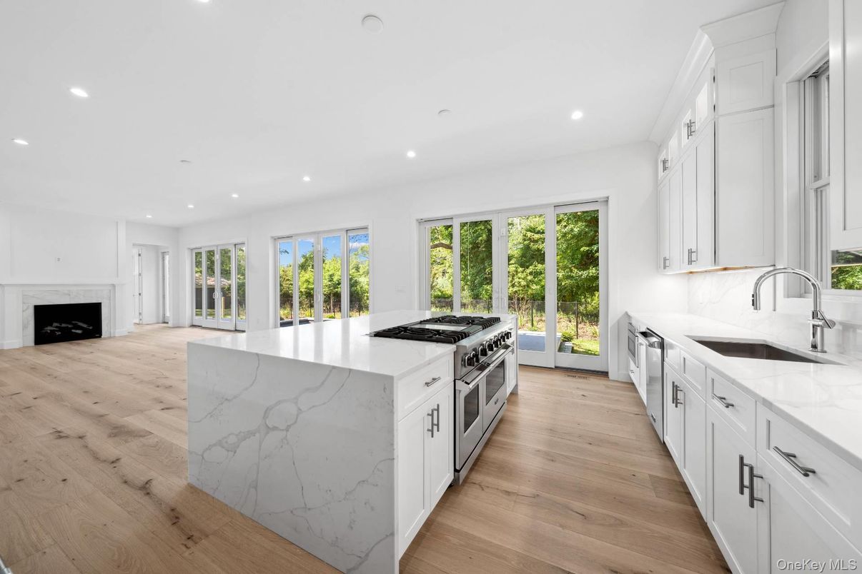 Fireplace, Interior, Kitchen, Recessed Lighting, Stainless Steel Appliances, Wood Texture Flooring