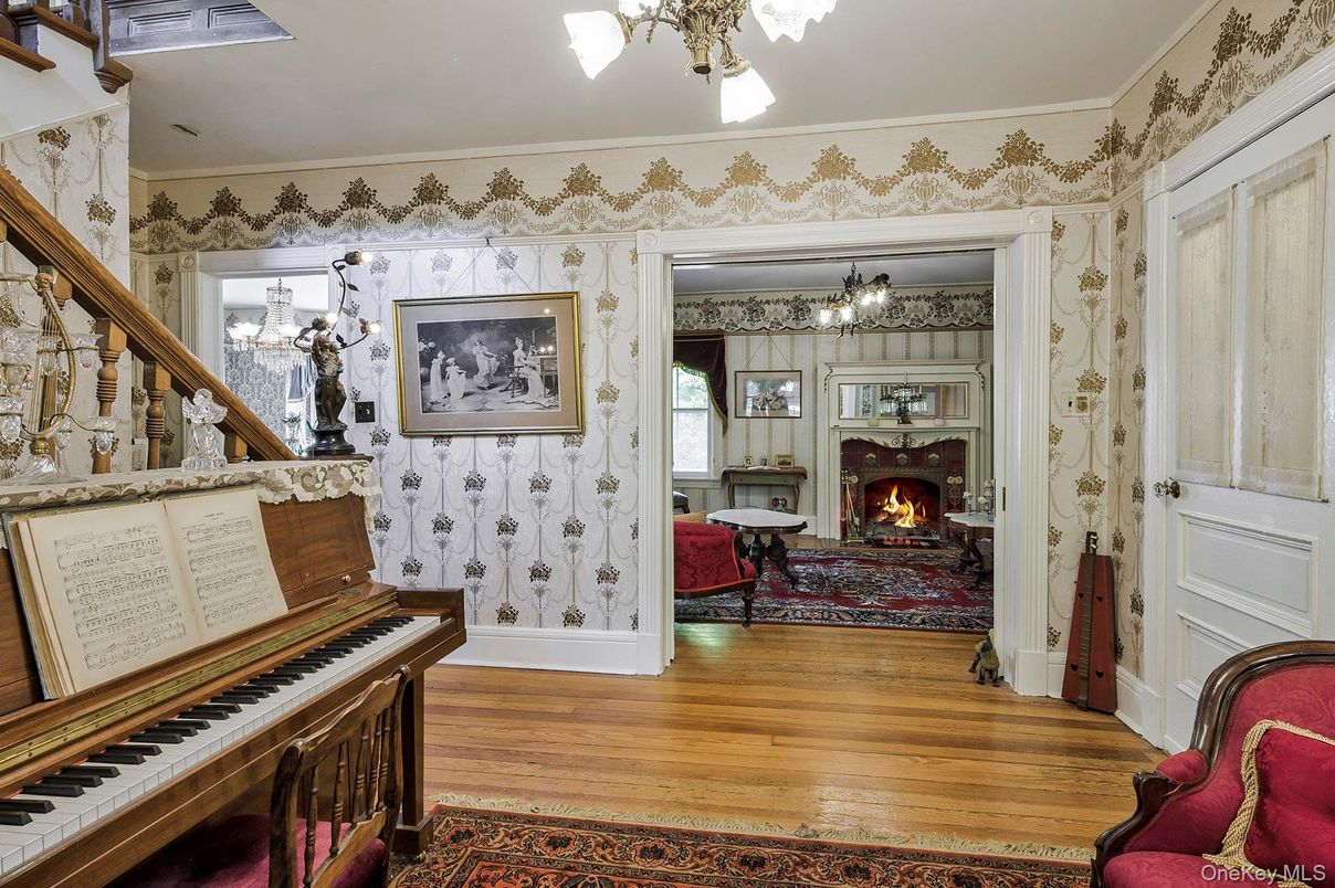 Chandelier, Fireplace, Interior, Piano, Wood Texture Flooring