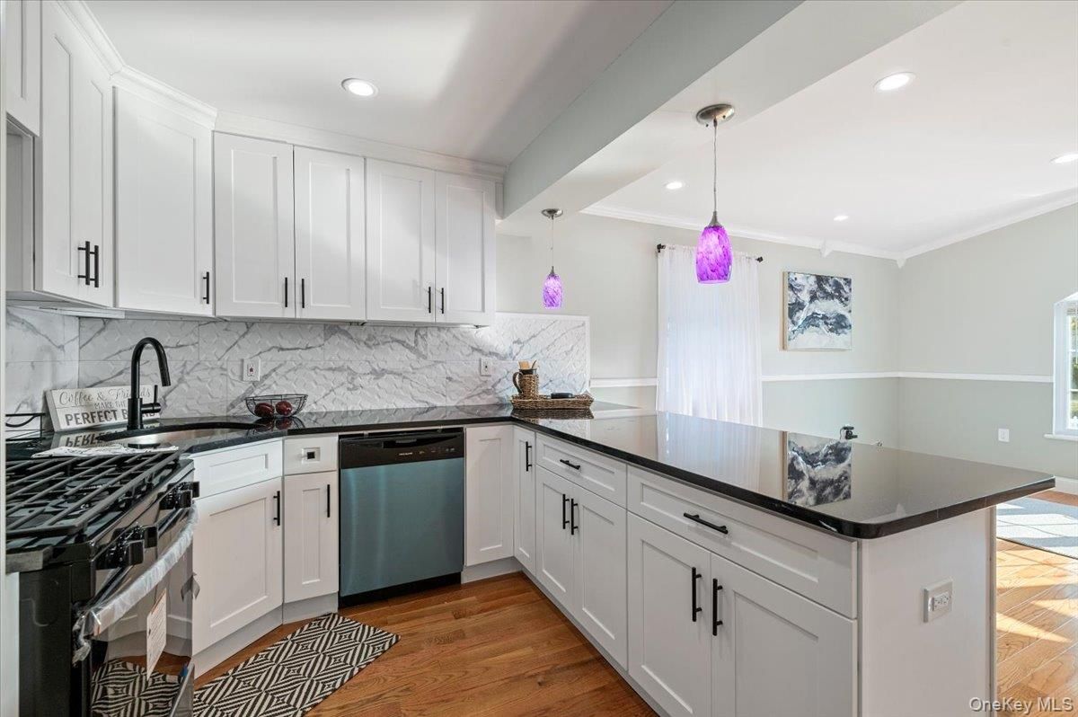 Interior, Kitchen, Marble Walls, Pendant Lights, Recessed Lighting, Stainless Steel Appliances, Wood Texture Flooring