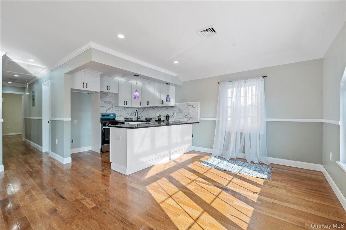 Interior, Kitchen, Marble Walls, Recessed Lighting, Stainless Steel Appliances, Wood Texture Flooring