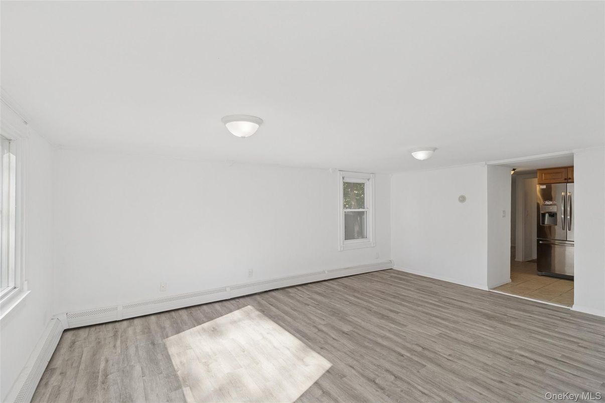 Empty room, Interior, Kitchen, Stainless Steel Appliances, Wood Texture Flooring