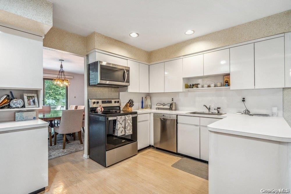Dining room, Interior, Kitchen, Pendant Lights, Recessed Lighting, Stainless Steel Appliances, Wood Texture Flooring