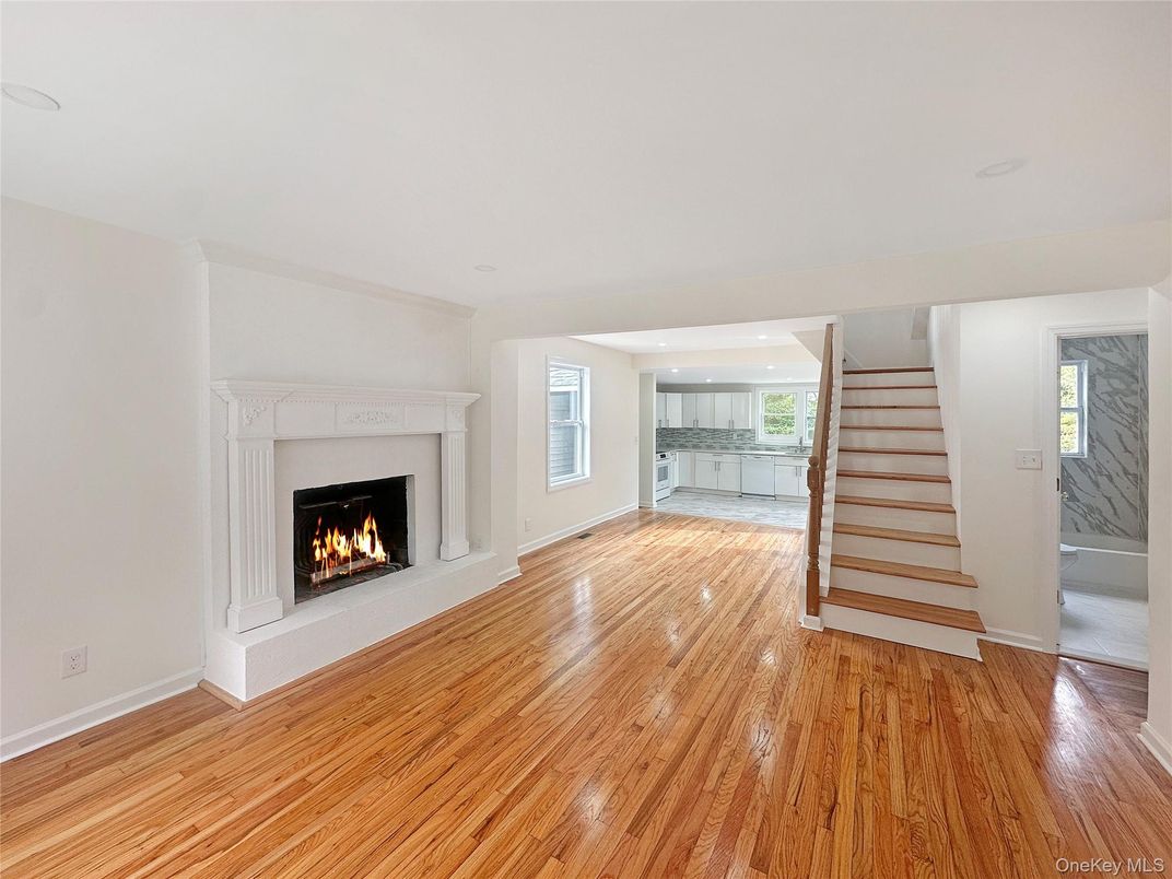 Empty room, Fireplace, Interior, Kitchen, Recessed Lighting, Wood Texture Flooring