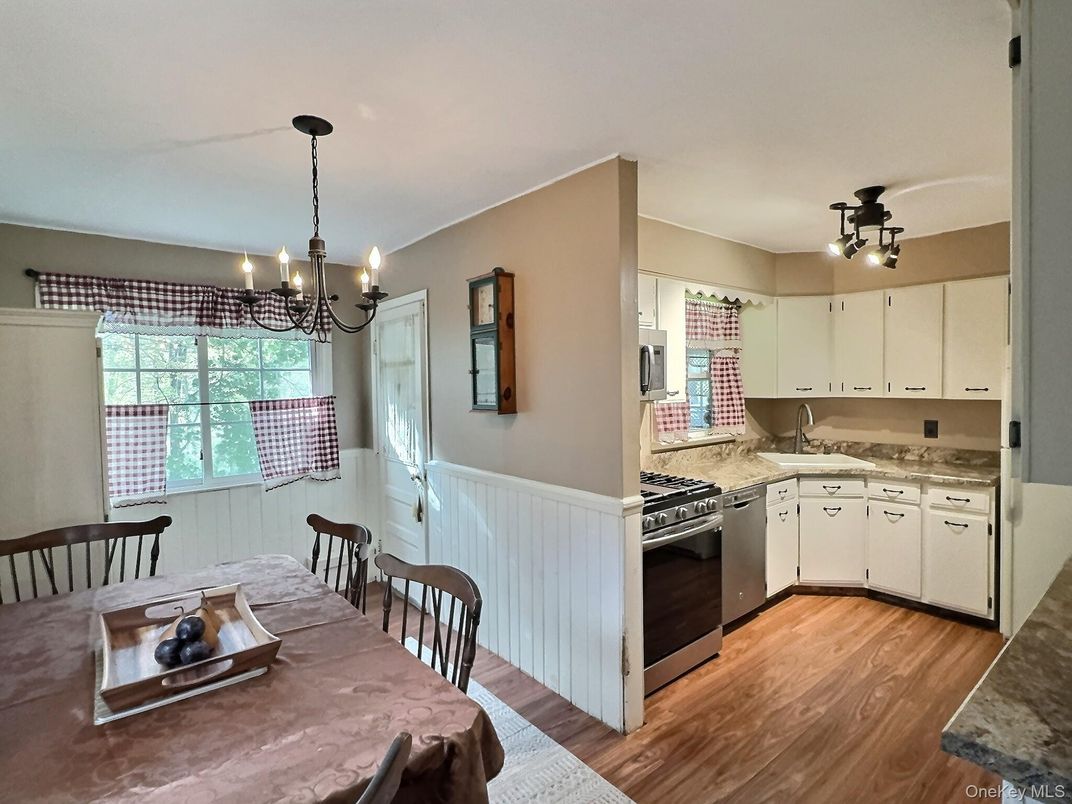 Chandelier, Dining room, Interior, Kitchen, Pendant Lights, Stainless Steel Appliances, Wood Texture Flooring