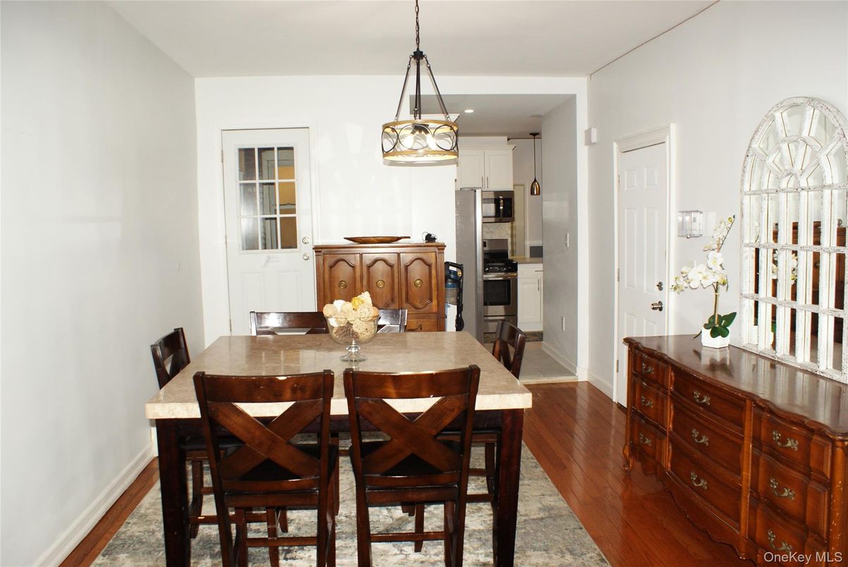 Dining room, Interior, Kitchen, Pendant Lights, Recessed Lighting, Stainless Steel Appliances, Wood Texture Flooring