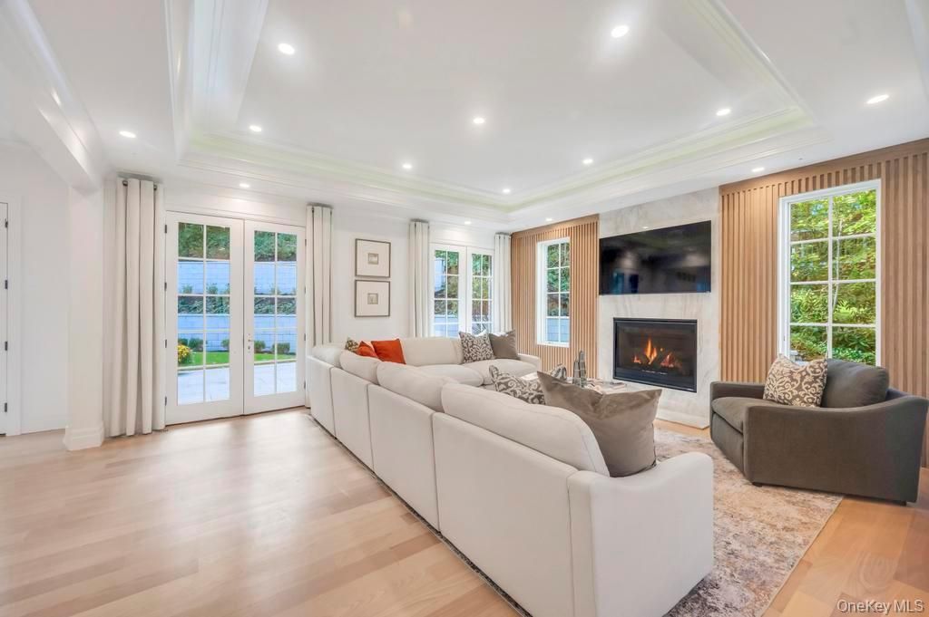 Fireplace, Interior, Living room, Recessed Lighting, Water, Wood Texture Flooring