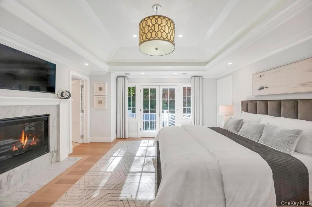 Bedroom, Fireplace, Interior, Pendant Lights, Recessed Lighting, Wood Texture Flooring