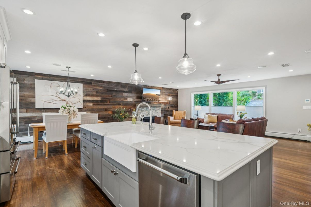 Dining room, Interior, Kitchen, Pendant Lights, Recessed Lighting, Stainless Steel Appliances, Wood Texture Flooring, Wooden Walls