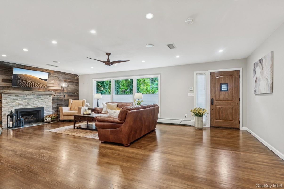 Fireplace, Interior, Living room, Recessed Lighting, Stone Walls, Wood Texture Flooring