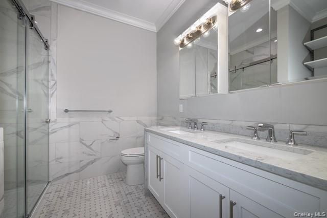 Bathroom, Dual Sink Vanities, Glass Shower, Interior, Marble Walls, Recessed Lighting