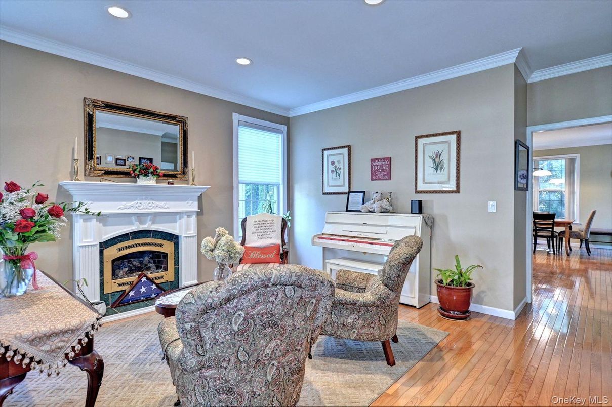 Dining room, Fireplace, Interior, Living room, Piano, Recessed Lighting, Wood Texture Flooring