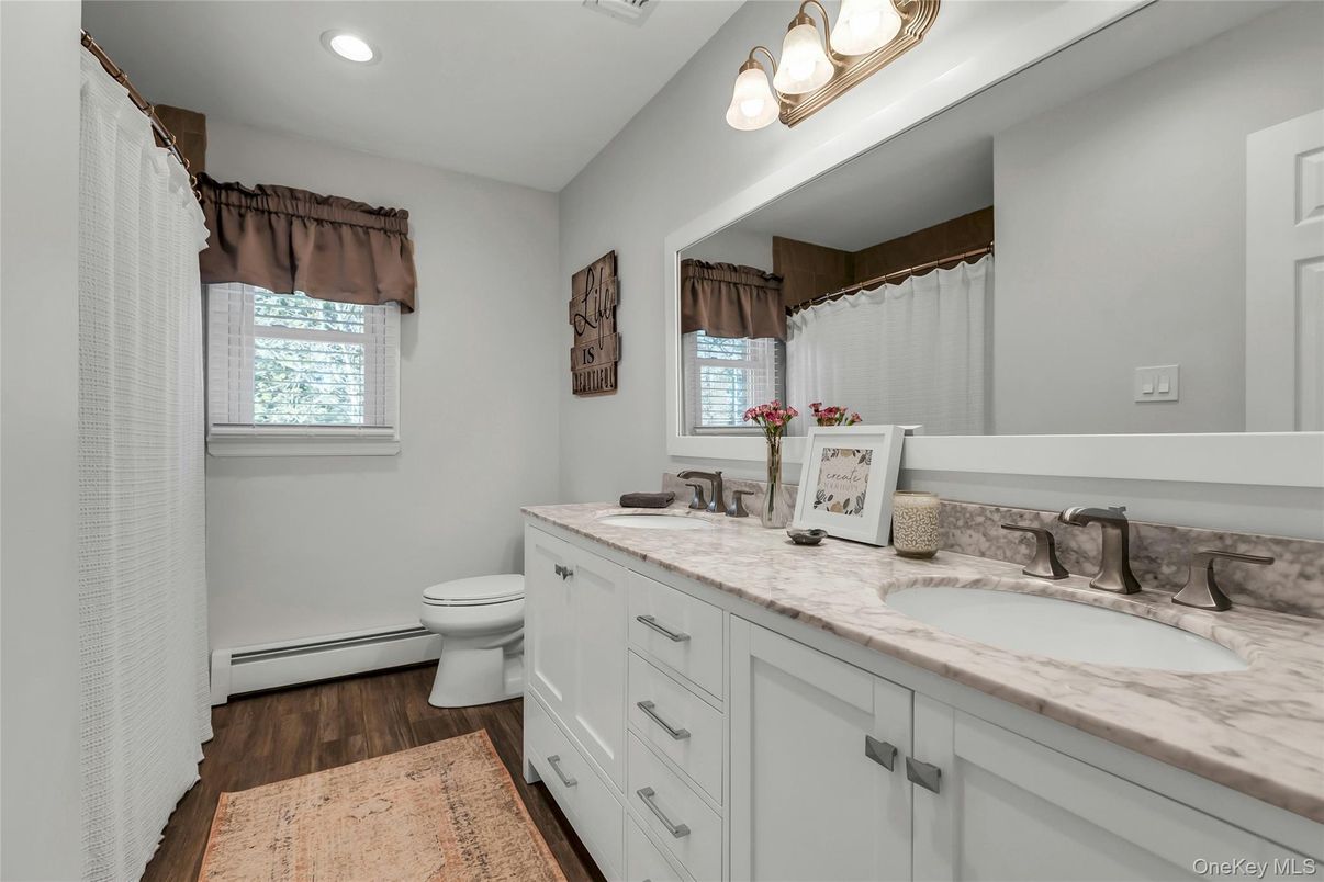 Bathroom, Dual Sink Vanities, Interior, Recessed Lighting, Wood Texture Flooring