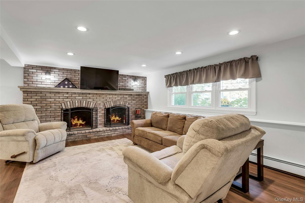 Fireplace, Interior, Living room, Recessed Lighting, Stone Walls, Wood Texture Flooring