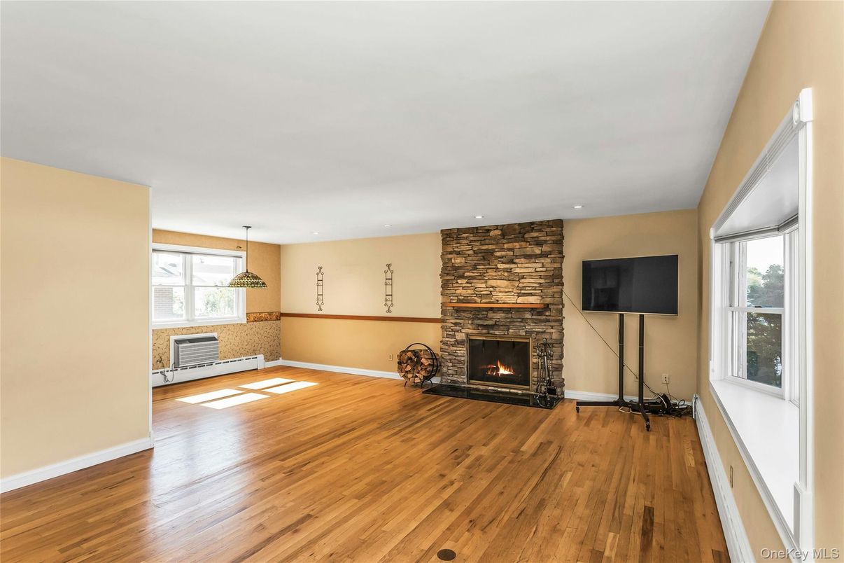 Empty room, Fireplace, Interior, Recessed Lighting, Stone Walls, Wood Texture Flooring